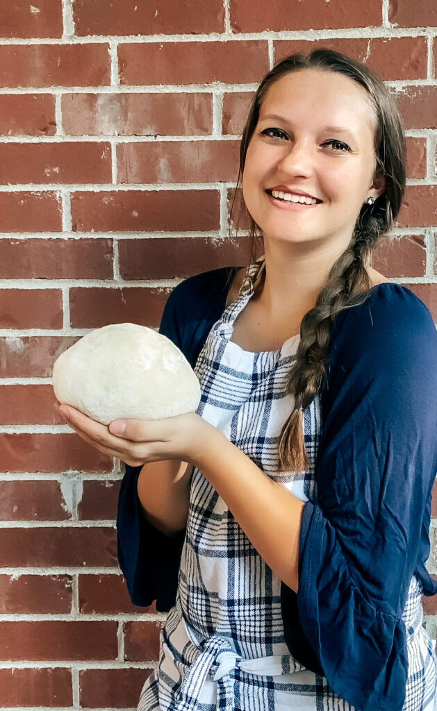 Baker Holding Ball of Bread Dough